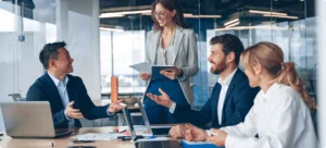 Business team members collaborating and sharing ideas at a round table in a meeting room